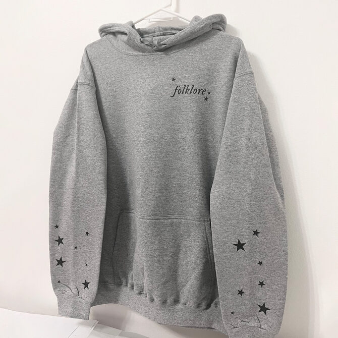 a grey sweatshirt with stars on it