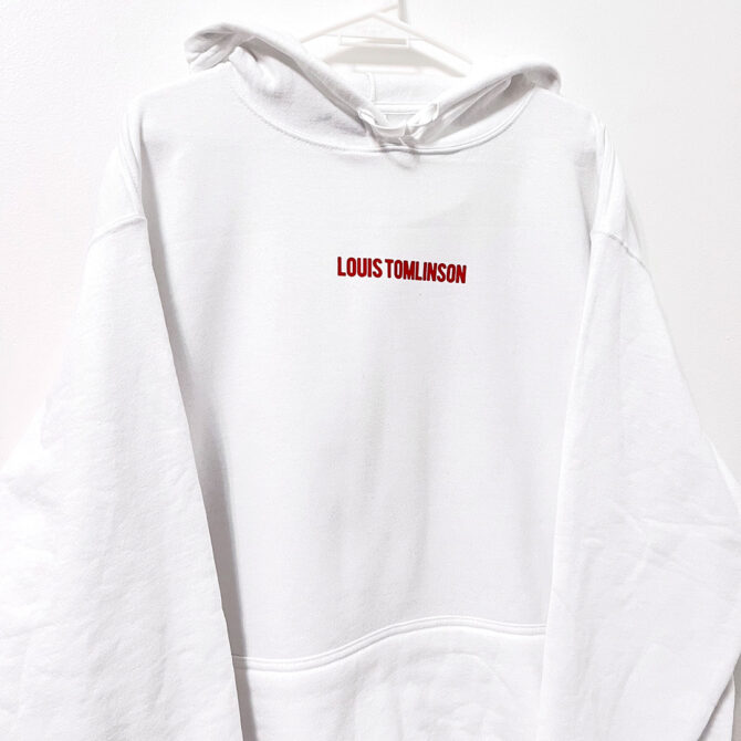 a white sweatshirt with red text on it