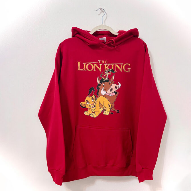 a red sweatshirt with cartoon characters on it - Rey Leon